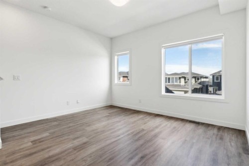 703-24 Rivercrest Drive, Cochrane, AB - Indoor Photo Showing Other Room