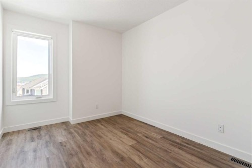 703-24 Rivercrest Drive, Cochrane, AB - Indoor Photo Showing Other Room