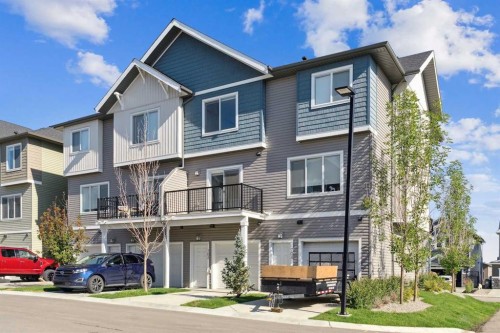 703-24 Rivercrest Drive, Cochrane, AB - Outdoor With Facade