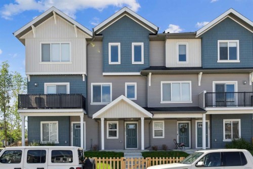 703-24 Rivercrest Drive, Cochrane, AB - Outdoor With Facade