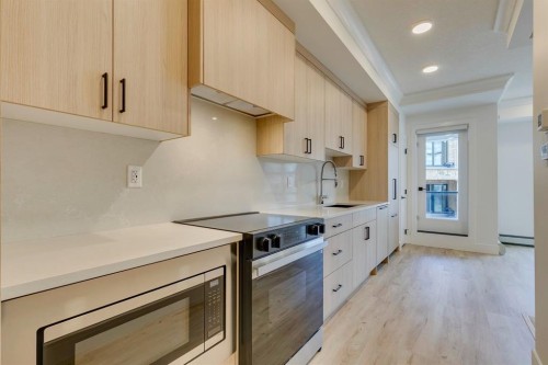 1314-4270 Norford Avenue Nw, Calgary, AB - Indoor Photo Showing Kitchen With Upgraded Kitchen