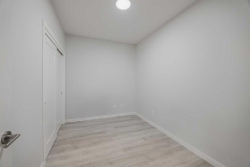 102-200 Shawnee Square Sw, Calgary, AB - Indoor Photo Showing Other Room