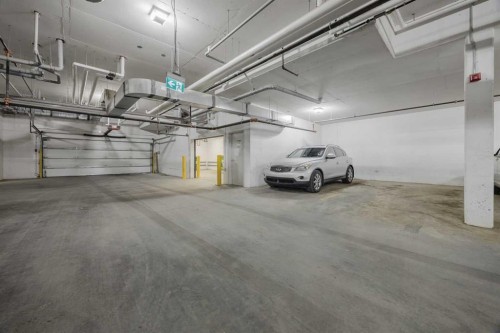 102-200 Shawnee Square Sw, Calgary, AB - Indoor Photo Showing Garage