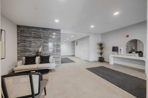 102-200 Shawnee Square Sw, Calgary, AB - Indoor Photo Showing Other Room