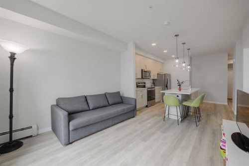 102-200 Shawnee Square Sw, Calgary, AB - Indoor Photo Showing Other Room