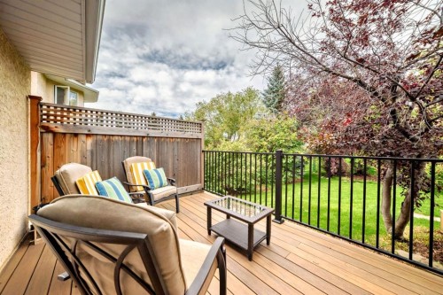 83 Gleneagles Close, Cochrane, AB - Outdoor With Deck Patio Veranda With Exterior
