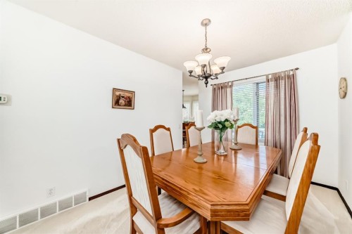 83 Gleneagles Close, Cochrane, AB - Indoor Photo Showing Dining Room