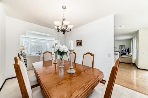 83 Gleneagles Close, Cochrane, AB - Indoor Photo Showing Dining Room