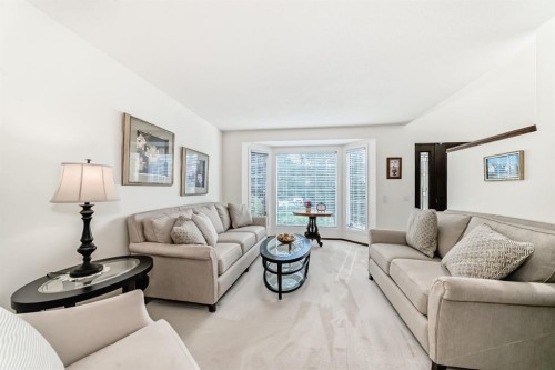 83 Gleneagles Close, Cochrane, AB - Indoor Photo Showing Living Room