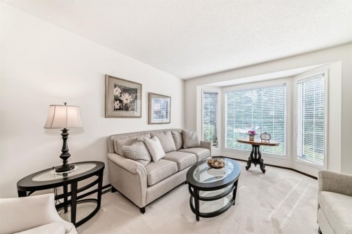 83 Gleneagles Close, Cochrane, AB - Indoor Photo Showing Living Room
