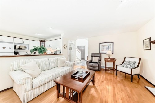 83 Gleneagles Close, Cochrane, AB - Indoor Photo Showing Living Room