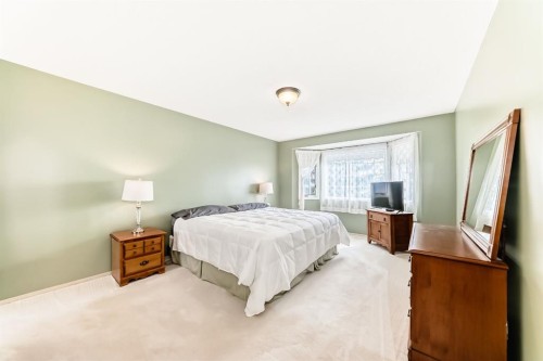 83 Gleneagles Close, Cochrane, AB - Indoor Photo Showing Bedroom