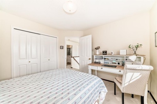 83 Gleneagles Close, Cochrane, AB - Indoor Photo Showing Bedroom