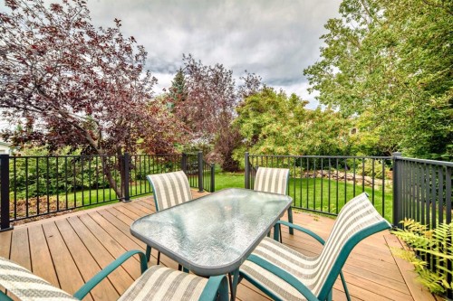 83 Gleneagles Close, Cochrane, AB - Outdoor With Deck Patio Veranda