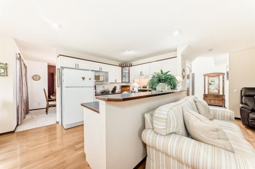 83 Gleneagles Close, Cochrane, AB - Indoor Photo Showing Kitchen