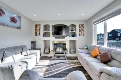140 Saddlehorn Crescent Ne, Calgary, AB - Indoor Photo Showing Living Room With Fireplace