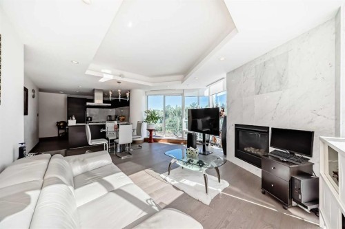 302-738 1 Avenue Sw, Calgary, AB - Indoor Photo Showing Living Room With Fireplace