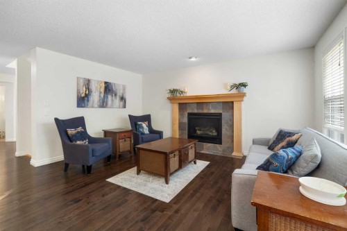 29 Sunset Close, Cochrane, AB - Indoor Photo Showing Living Room With Fireplace