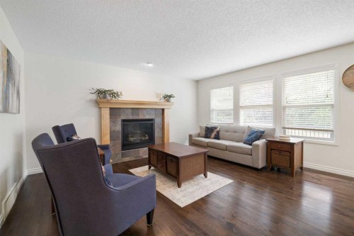 29 Sunset Close, Cochrane, AB - Indoor Photo Showing Living Room With Fireplace