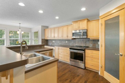 29 Sunset Close, Cochrane, AB - Indoor Photo Showing Kitchen With Double Sink