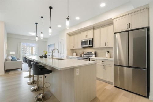 308-80 Carrington Plaza Nw, Calgary, AB - Indoor Photo Showing Kitchen With Stainless Steel Kitchen With Upgraded Kitchen