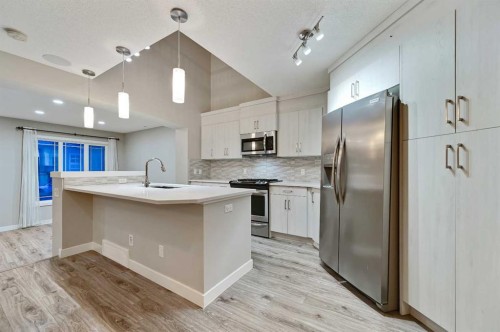 26 Howse Row Ne, Calgary, AB - Indoor Photo Showing Kitchen With Stainless Steel Kitchen With Upgraded Kitchen