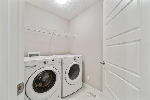 26 Howse Row Ne, Calgary, AB - Indoor Photo Showing Laundry Room