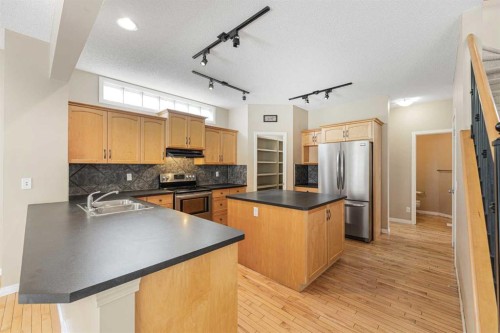 72 Rockyledge Crescent Nw, Calgary, AB - Indoor Photo Showing Kitchen With Double Sink