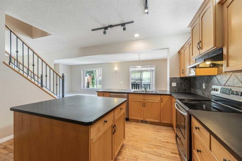 72 Rockyledge Crescent Nw, Calgary, AB - Indoor Photo Showing Kitchen With Double Sink