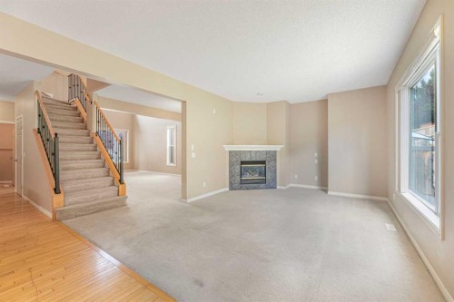 72 Rockyledge Crescent Nw, Calgary, AB - Indoor With Fireplace