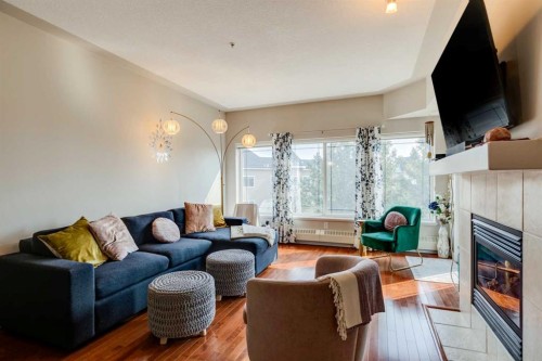 534-10 Discovery Ridge Close Sw, Calgary, AB - Indoor Photo Showing Living Room With Fireplace