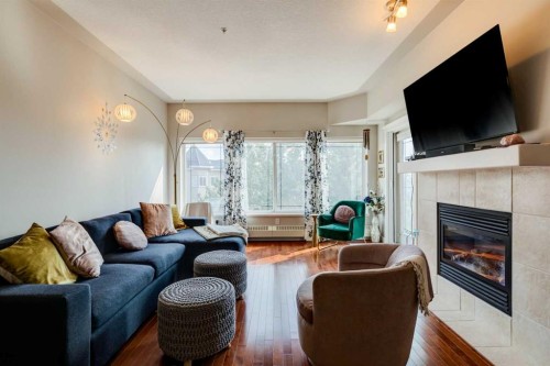 534-10 Discovery Ridge Close Sw, Calgary, AB - Indoor Photo Showing Living Room With Fireplace