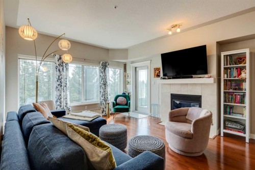 534-10 Discovery Ridge Close Sw, Calgary, AB - Indoor Photo Showing Living Room With Fireplace