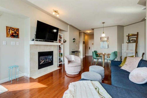 534-10 Discovery Ridge Close Sw, Calgary, AB - Indoor Photo Showing Living Room With Fireplace