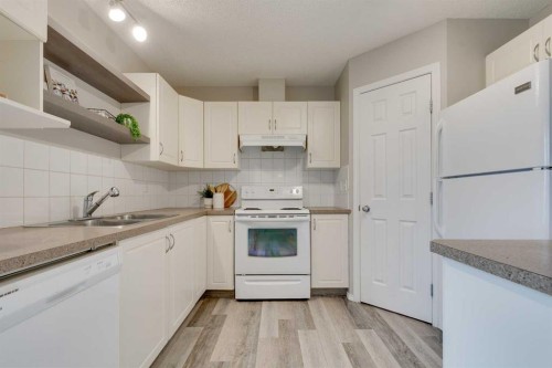 910 Prairie Sound Circle Nw, High River, AB - Indoor Photo Showing Kitchen With Double Sink