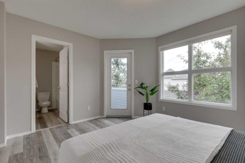 910 Prairie Sound Circle Nw, High River, AB - Indoor Photo Showing Bedroom