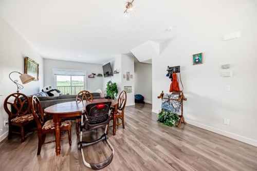 1703 Jumping Pound Common, Cochrane, AB - Indoor Photo Showing Dining Room