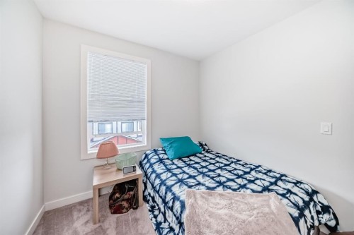 1703 Jumping Pound Common, Cochrane, AB - Indoor Photo Showing Bedroom