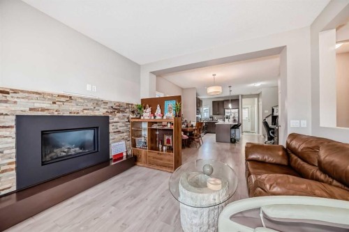 9 Copperpond Avenue Se, Calgary, AB - Indoor Photo Showing Living Room With Fireplace