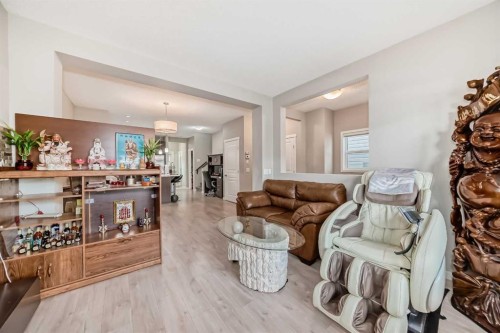 9 Copperpond Avenue Se, Calgary, AB - Indoor Photo Showing Living Room