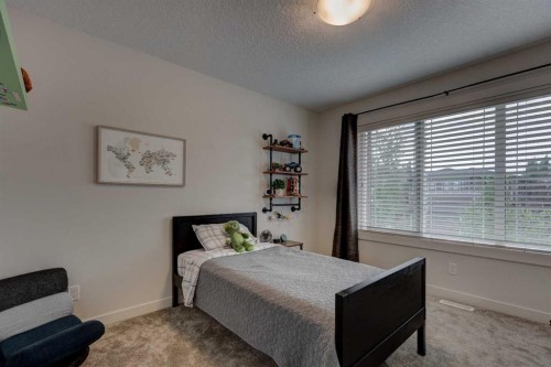 19 Cranbrook Crescent Se, Calgary, AB - Indoor Photo Showing Bedroom