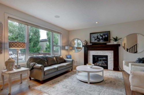 19 Cranbrook Crescent Se, Calgary, AB - Indoor Photo Showing Living Room With Fireplace