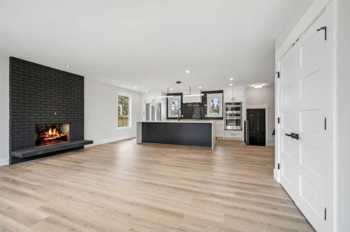 36 Maple Court Crescent Se, Calgary, AB - Indoor Photo Showing Living Room With Fireplace