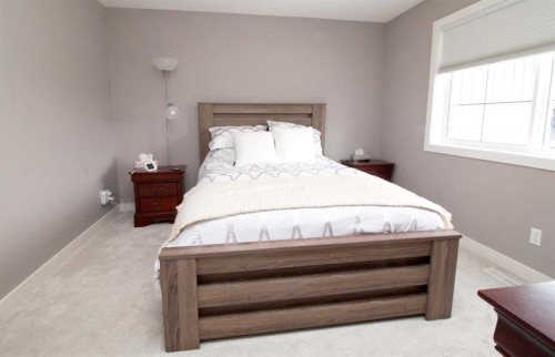 103 Sunrise Common, Cochrane, AB - Indoor Photo Showing Bedroom