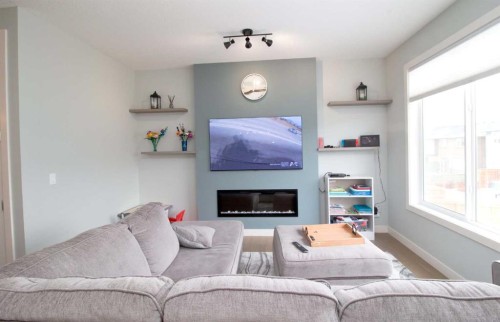103 Sunrise Common, Cochrane, AB - Indoor With Fireplace