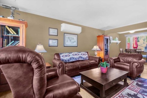 2211 45 Street Se, Calgary, AB - Indoor Photo Showing Living Room With Fireplace