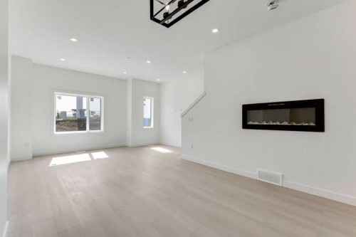 322 Sage Hill Circle Nw, Calgary, AB - Indoor Photo Showing Living Room With Fireplace