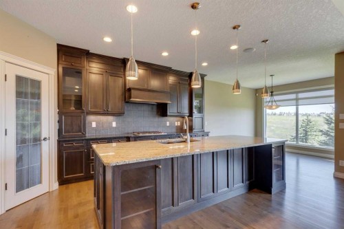 144 Tuscany Ravine Heights Nw, Calgary, AB - Indoor Photo Showing Kitchen With Double Sink With Upgraded Kitchen