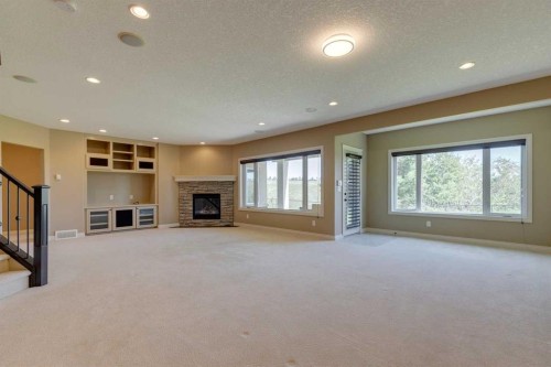 144 Tuscany Ravine Heights Nw, Calgary, AB - Indoor With Fireplace