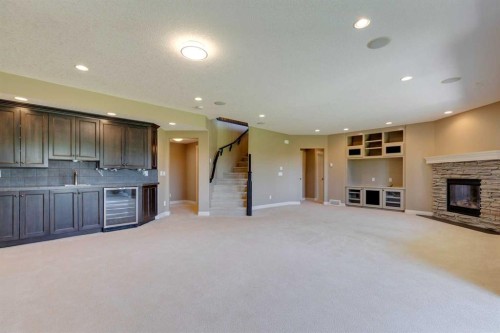 144 Tuscany Ravine Heights Nw, Calgary, AB - Indoor With Fireplace